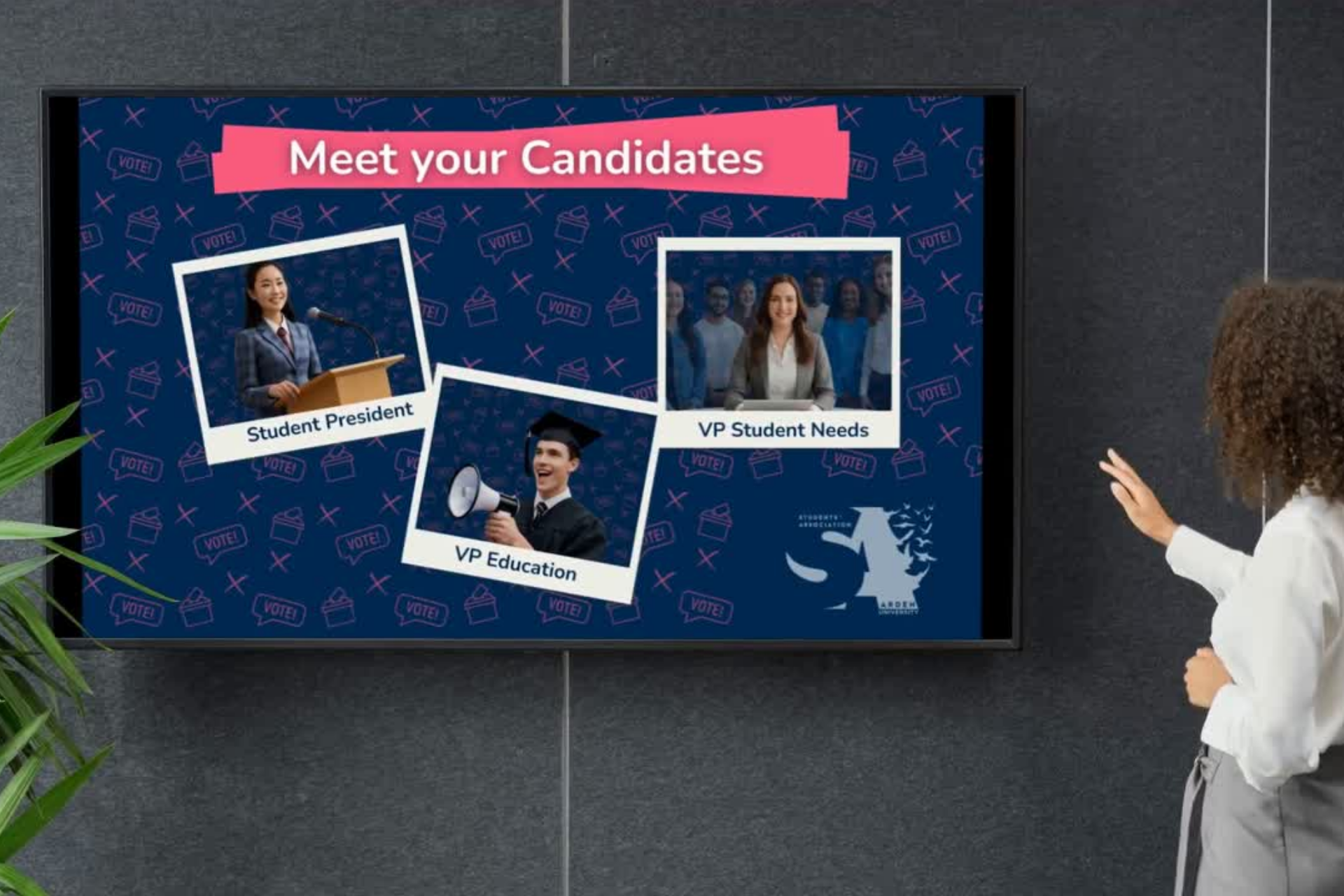 Person standing at the front of a room presenting. On the screen is three pictures of candidates with the roles under each.