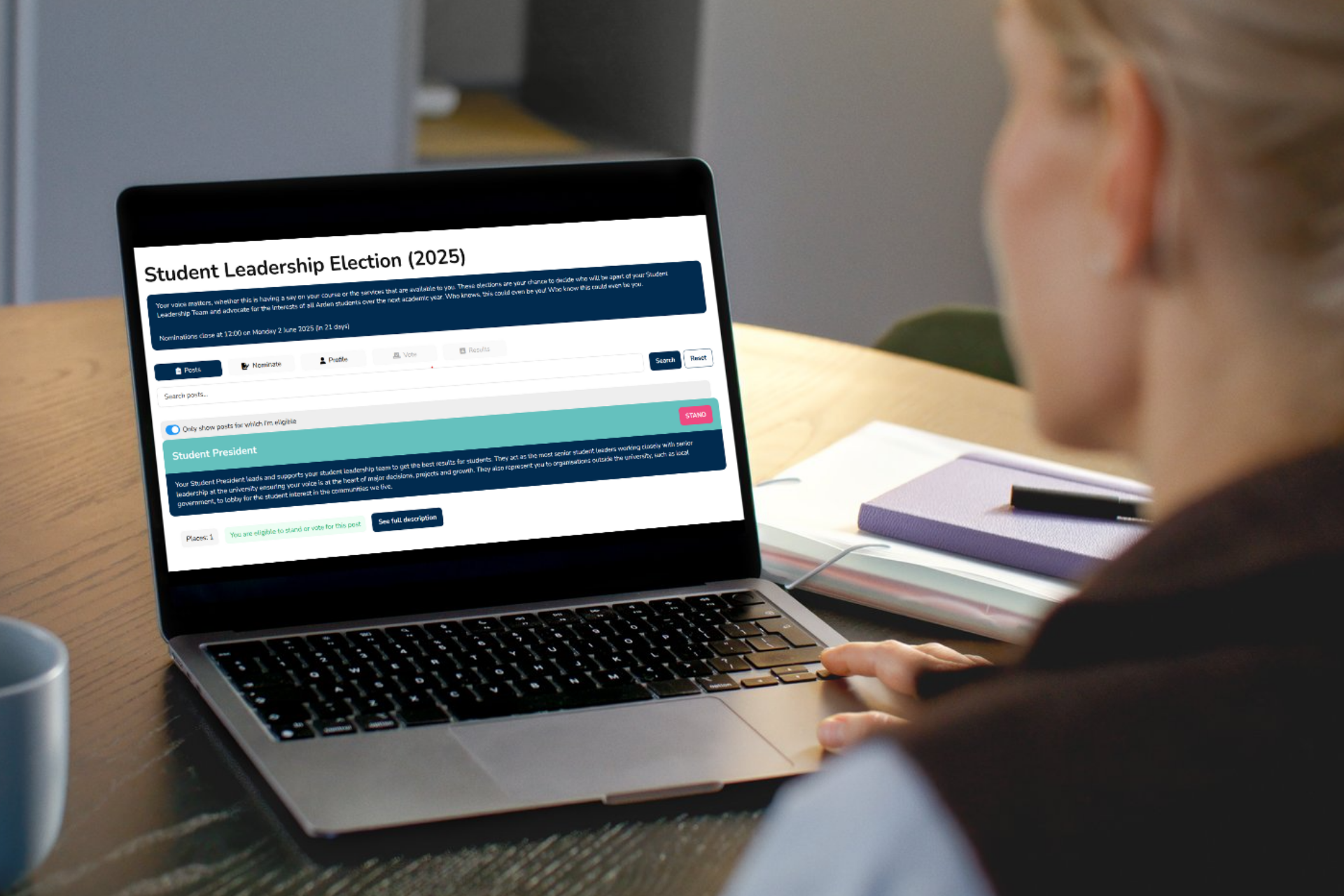 Women sitting at their laptop with the election nominations webpage open